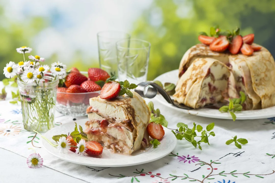 Midsummer dessert: pancake cake with rhubarb and strawberries